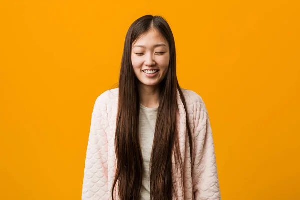 Young Chinese Woman Pajama Laughs Closes Eyes Feels Relaxed Happy — Stock Photo, Image