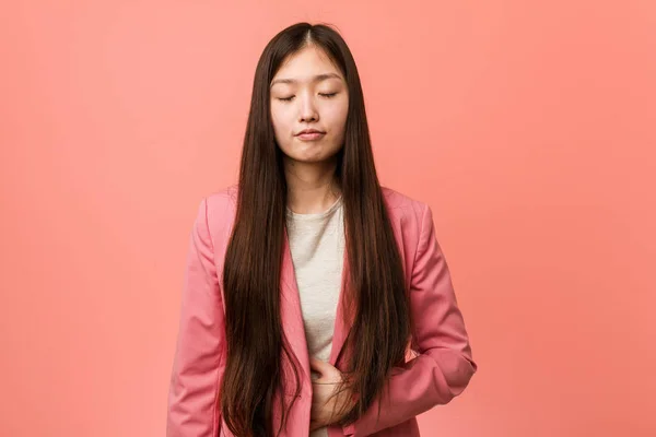 Young Business Chinese Woman Wearing Pink Suit Touches Tummy Smiles — 스톡 사진