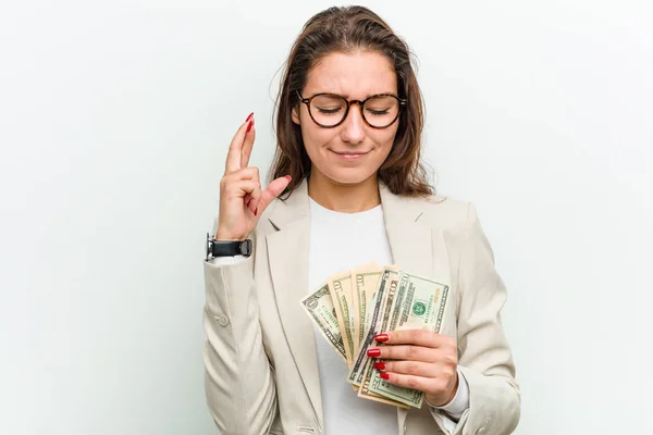 Young European Business Woman Holding Dollar Banknotes Crossing Fingers Having — 스톡 사진