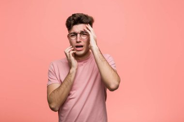 Young cool caucasian man whining and crying disconsolately.