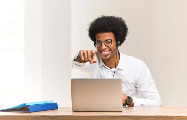 Young telemarketer black man dreams of achieving goals and purposes