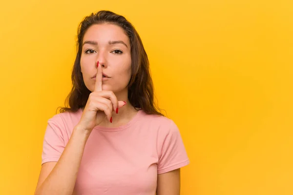 Young European Woman Isolated Yellow Background Keeping Secret Asking Silence — Stock Photo, Image