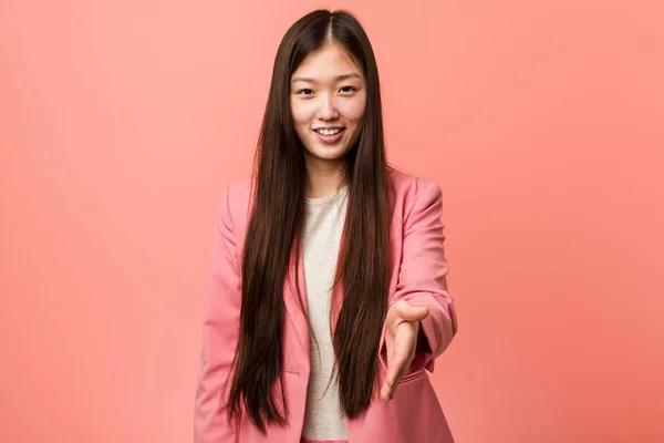 Young Business Chinese Woman Wearing Pink Suit Stretching Hand Camera — 스톡 사진