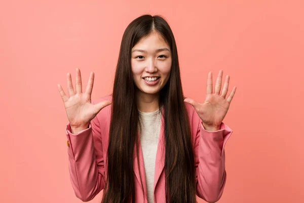 Young Business Chinese Woman Wearing Pink Suit Showing Number Ten — 스톡 사진