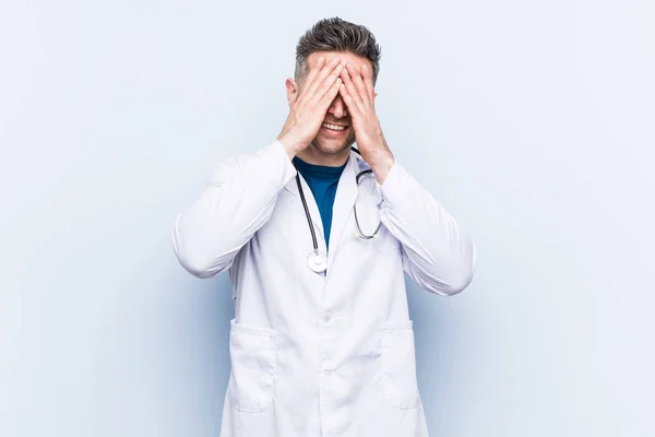 Young Handsome Doctor Man Covers Eyes Hands Smiles Broadly Waiting — Stock Photo, Image