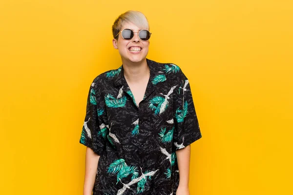 stock image Young curvy woman wearing a summer look laughs and closes eyes, feels relaxed and happy.