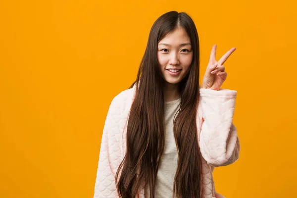Young Chinese Woman Pajama Showing Victory Sign Smiling Broadly — 스톡 사진