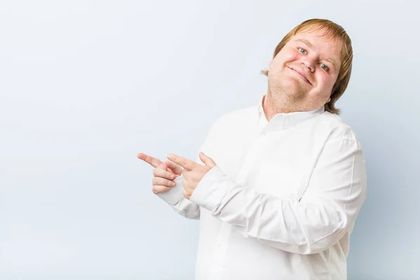 Young Authentic Redhead Fat Man Excited Pointing Forefingers Away — Stock Photo, Image