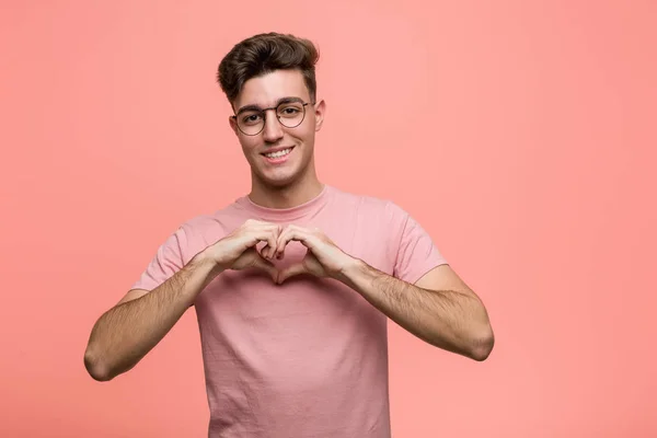 Young Cool Caucasian Man Smiling Showing Heart Shape Him Hands — Stock fotografie
