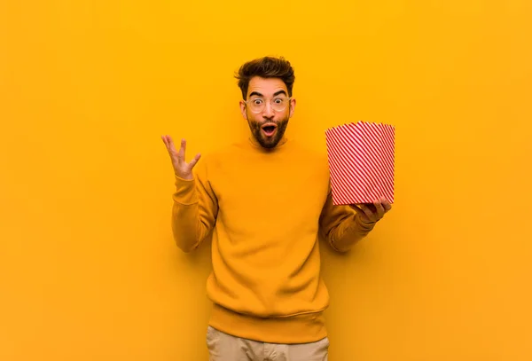 Young Man Holding Popcorns Celebrating Victory Success — Stock Photo, Image