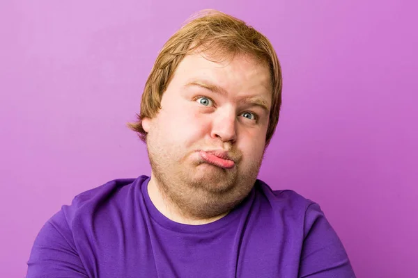 Young Authentic Redhead Fat Man Blows Cheeks Has Tired Expression — Stock Photo, Image