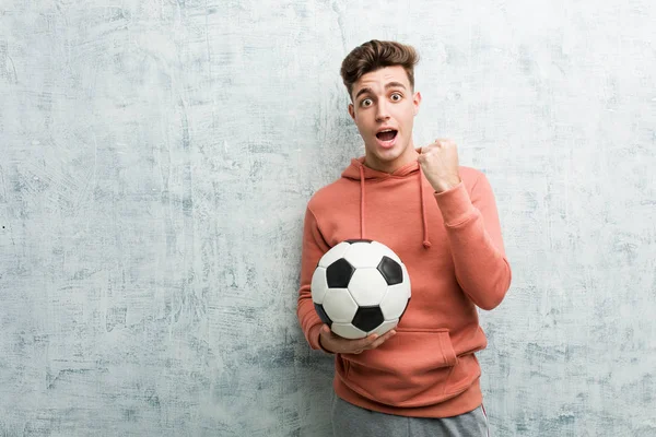 Young Sporty Man Holding Soccer Ball Cheering Carefree Excited Victory — 스톡 사진
