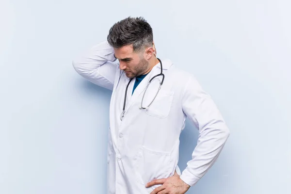 Young Handsome Doctor Man Touching Back Head Thinking Making Choice — ストック写真