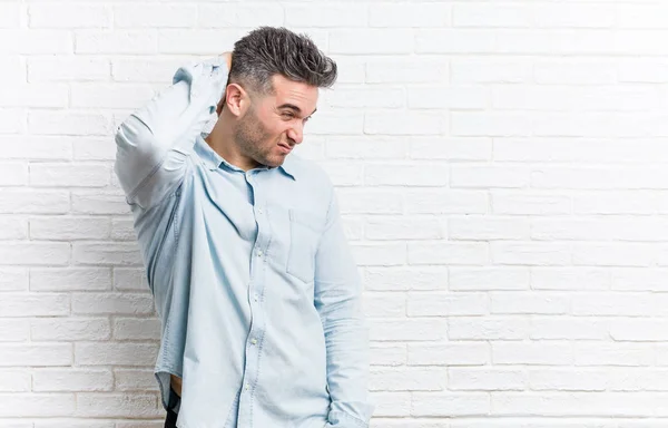 Young Handsome Man Bricks Wall Touching Back Head Thinking Making — Stock Photo, Image