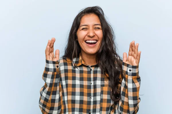 Young cool indian woman joyful laughing a lot. Happiness concept.