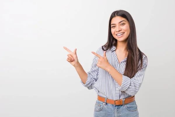 Young Pretty Arab Woman Pointing Forefingers Copy Space Expressing Excitement — Stock Photo, Image