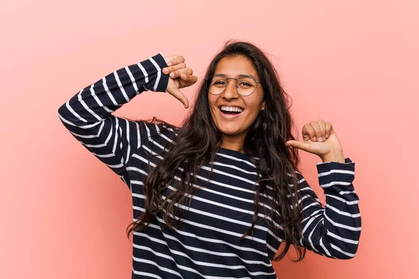 Young intellectual indian woman feels proud and self confident, example to follow.