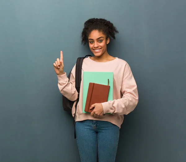 Young Student Black Woman Showing Number One She Holding Books — Stock Photo, Image