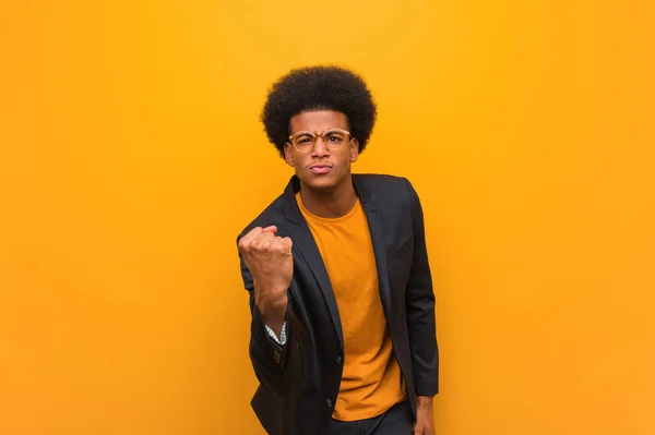 Young Business African American Man Orange Wall Showing Fist Front — Stock Photo, Image