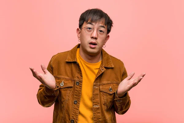 Young Chinese Man Wearing Jacket Surprised Shocked — Stock Photo, Image