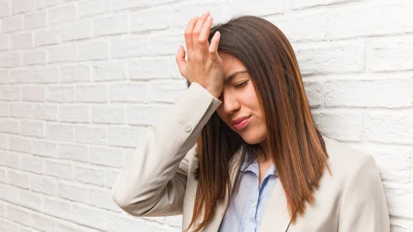 Young business woman forgetful, realize something