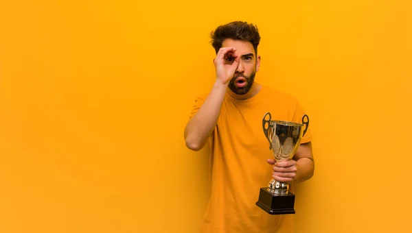 Young Man Holding Trophy Making Gesture Spyglass — Stock Photo, Image