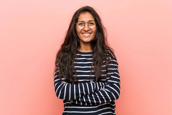 Young intellectual indian woman happy, smiling and cheerful.