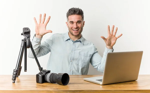 Young handsome photography teacher showing number ten with hands.