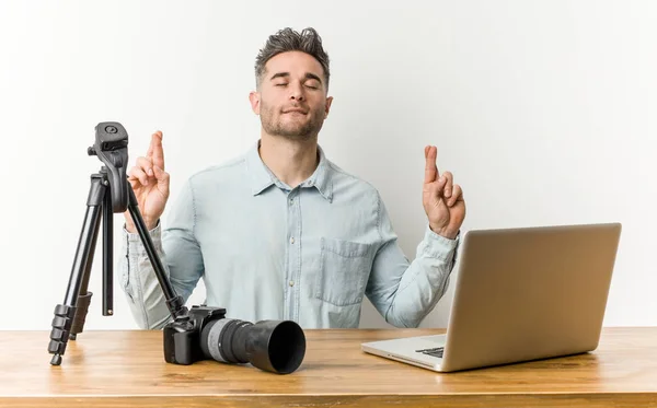 Young handsome photography teacher showing that she has no money.