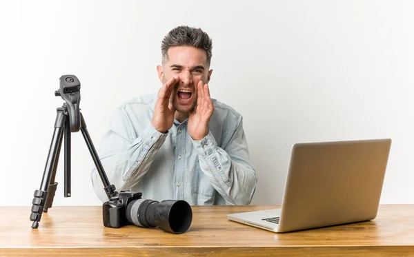 Young handsome photography teacher shouting excited to front.