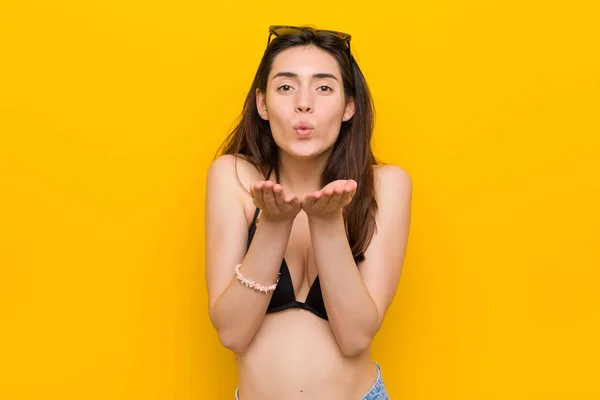 Young Brunette Woman Wearing Bikini Yellow Background Folding Lips Holding — Stock Photo, Image