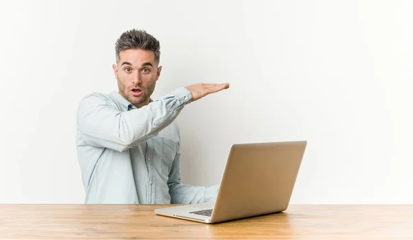 Young Handsome Man Working His Laptop Shocked Amazed Holding Copy — Stock Photo, Image