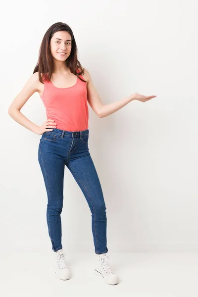 Full Body Young Woman White Background Showing Copy Space Palm — Stock Photo, Image