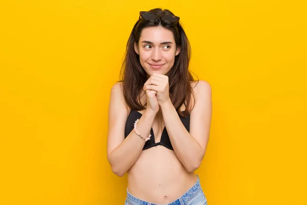 Young Brunette Woman Wearing Bikini Yellow Background Keeps Hands Chin — Stock Photo, Image