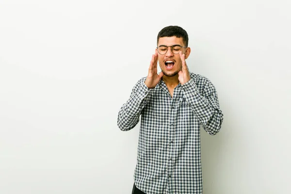 Young Hispanic Man Shouts Loud Keeps Eyes Opened Hands Tense — Stock Photo, Image