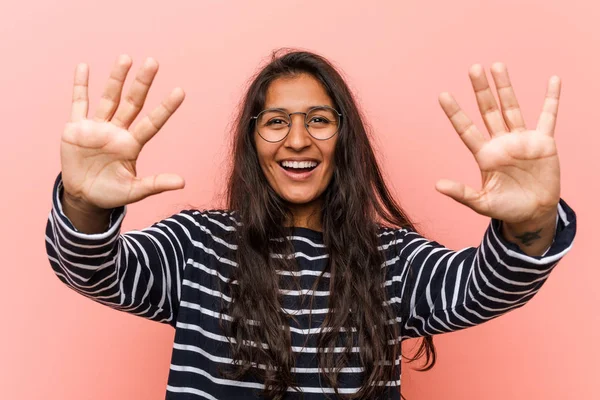 Young intellectual indian woman showing number ten with hands.