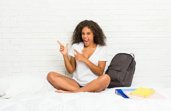 Young African American Student Woman Bed Pointing Forefingers Copy Space — Stock Photo, Image