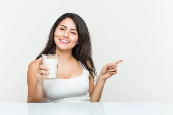 Young Hispanic Woman Holding Glass Milk Smiling Cheerfully Pointing Forefinger — Stock Photo, Image