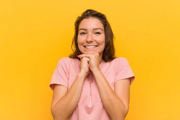 Young European Woman Isolated Yellow Background Keeps Hands Chin Looking — Stock Photo, Image