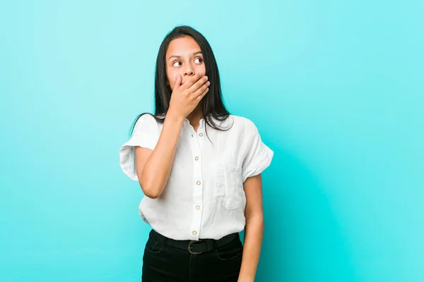 Young Hispanic Cool Woman Blue Wall Thoughtful Looking Copy Space — Stock Photo, Image