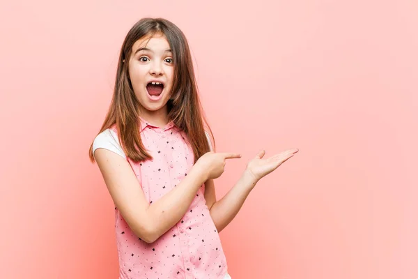 Cute Little Girl Excited Holding Copy Space Palm — Stock Photo, Image