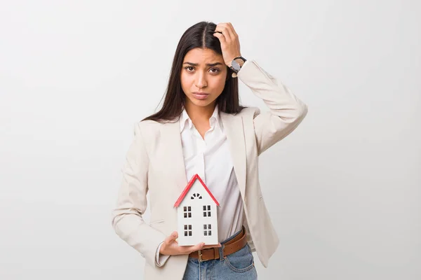 Young Arab Woman Holding House Icon Being Shocked She Has — Stock Photo, Image