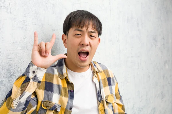 Young Chinese Man Face Closeup Doing Rock Gesture — Stock Photo, Image