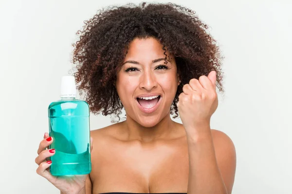 Young African American Woman Holding Mouthwash Cheering Carefree Excited Victory — Stock Photo, Image