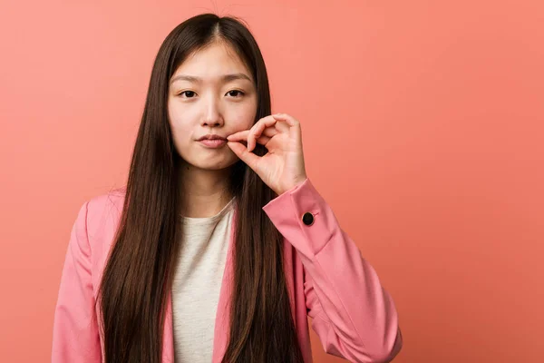 Young Business Chinese Woman Wearing Pink Suit Fingers Lips Keeping — 스톡 사진