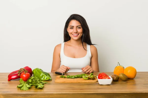 Young Hispanic Woman Cutting Vegetables Table — 스톡 사진