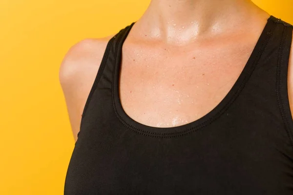 Young caucasian swimmer woman against a yellow background