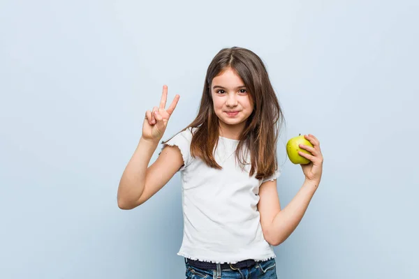 Little Caucasian Girl Holding Green Apple Showing Number Two Fingers — Stock Photo, Image