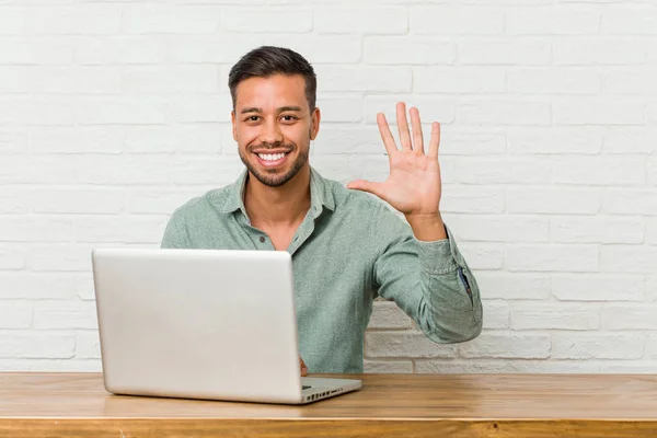 Young Filipino Man Sitting Working His Laptop Smiling Cheerful Showing — Stock Photo, Image