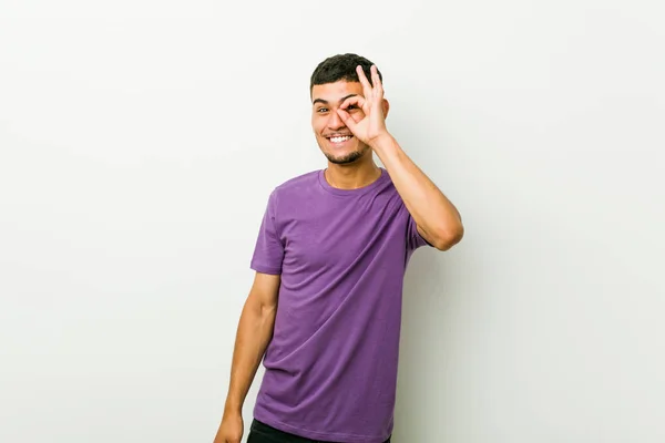Young Hispanic Man Excited Keeping Gesture Eye — Stock Photo, Image